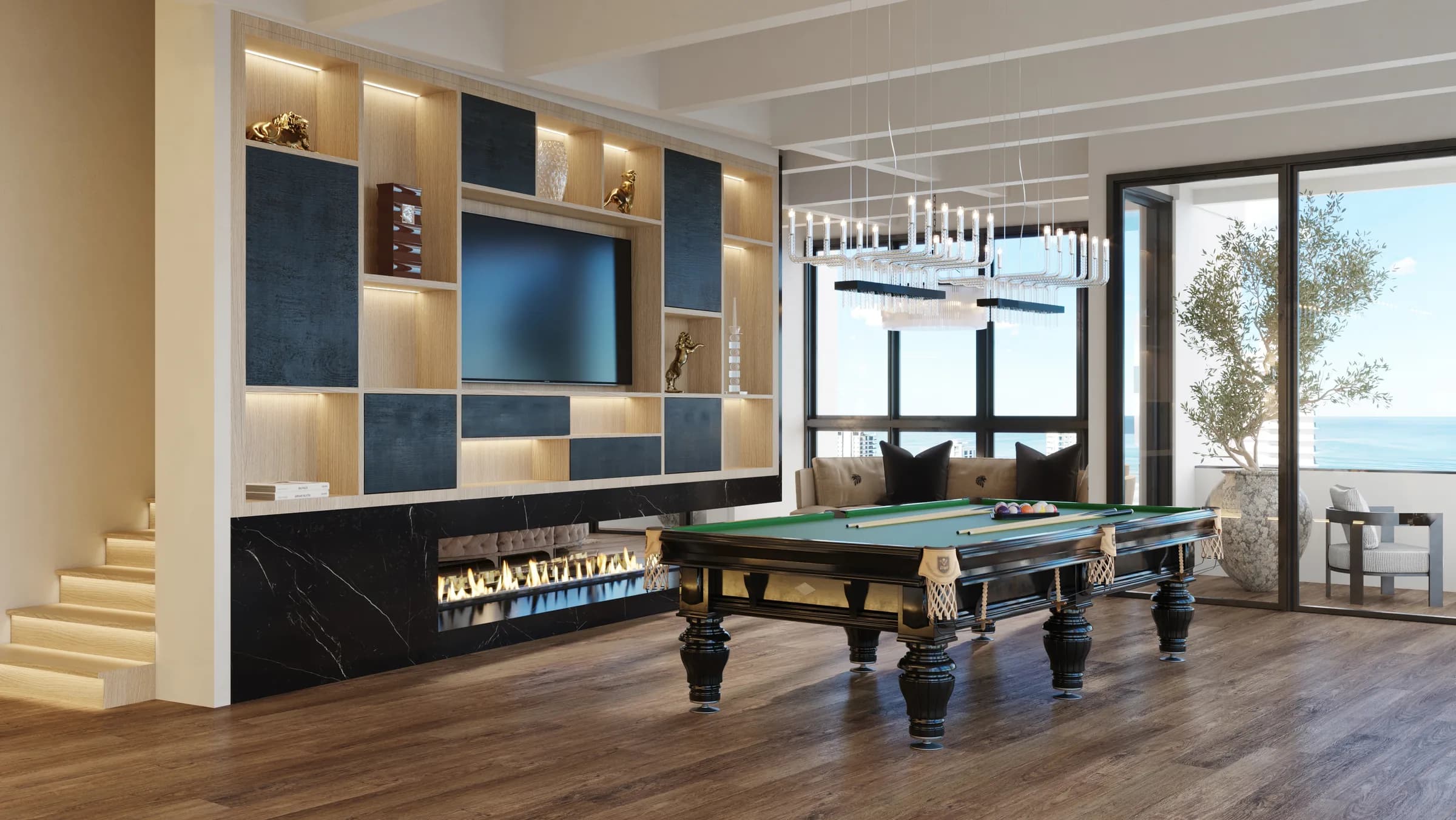 Games room with a green billiards table, timber flooring and a black marble fireplace beneath illuminated joinery